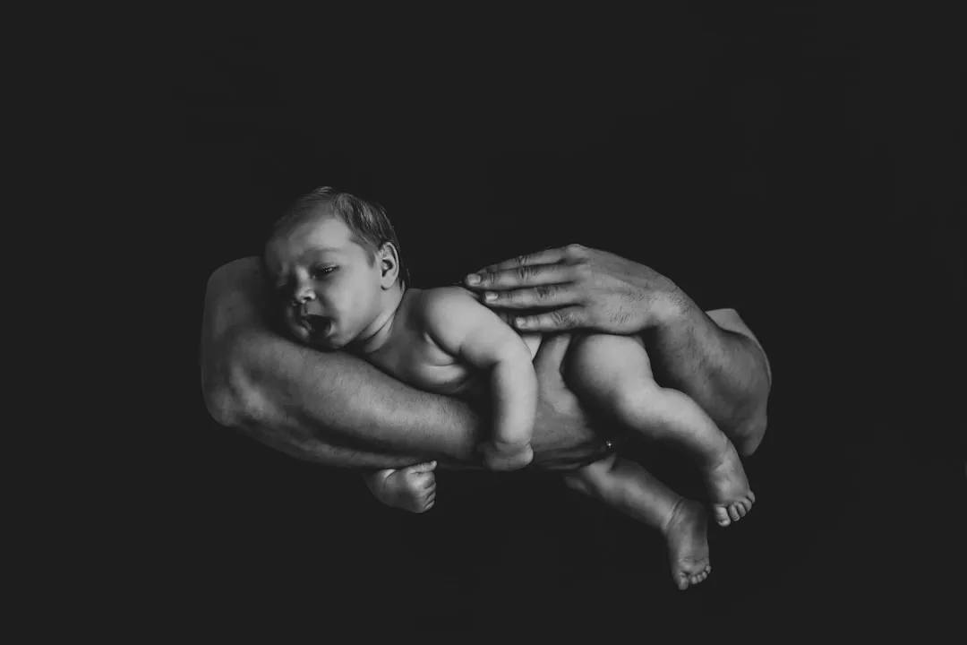 parent holding child during calm moment